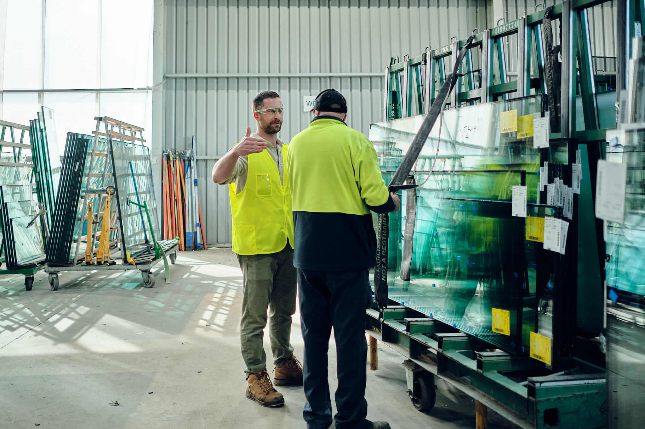Photo of two men in an industrial setting